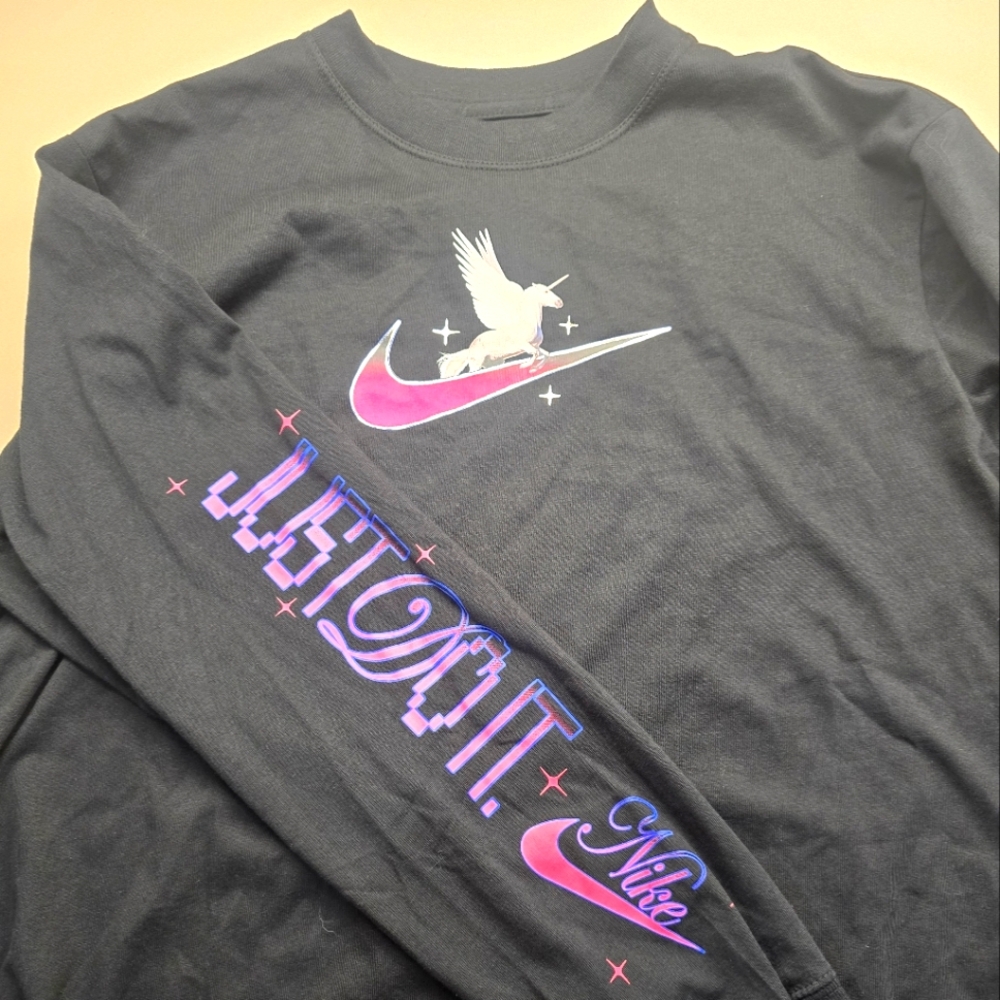 NWT - Nike Size Small Woman's loose fit long sleeve unicorn shirt.
